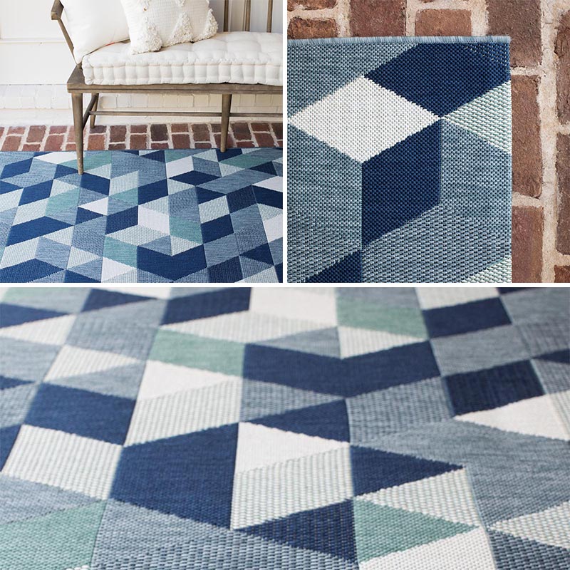 Outdoors, like on a patio or balcony, is a place where people don't often think they can include a rug, but they're ideal for creating a designated zone in an open space. #OutdoorRug #ModernOutdoorRug #BlueOutdoorRug #Decor