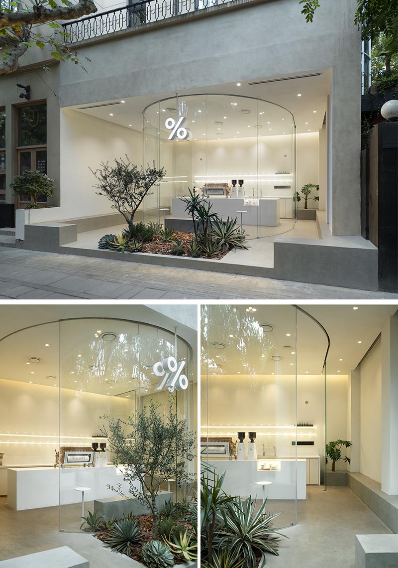 B.L.U.E. Architecture Studio has recently transformed a small 538 square foot (50 sqm) retail space into a modern and bright coffee shop in Shanghai, that features a curved glass facade. #ModernCoffeeShop #ModernCafe #CoffeeShop #Architecture #CafeDesign #CurvedGlass