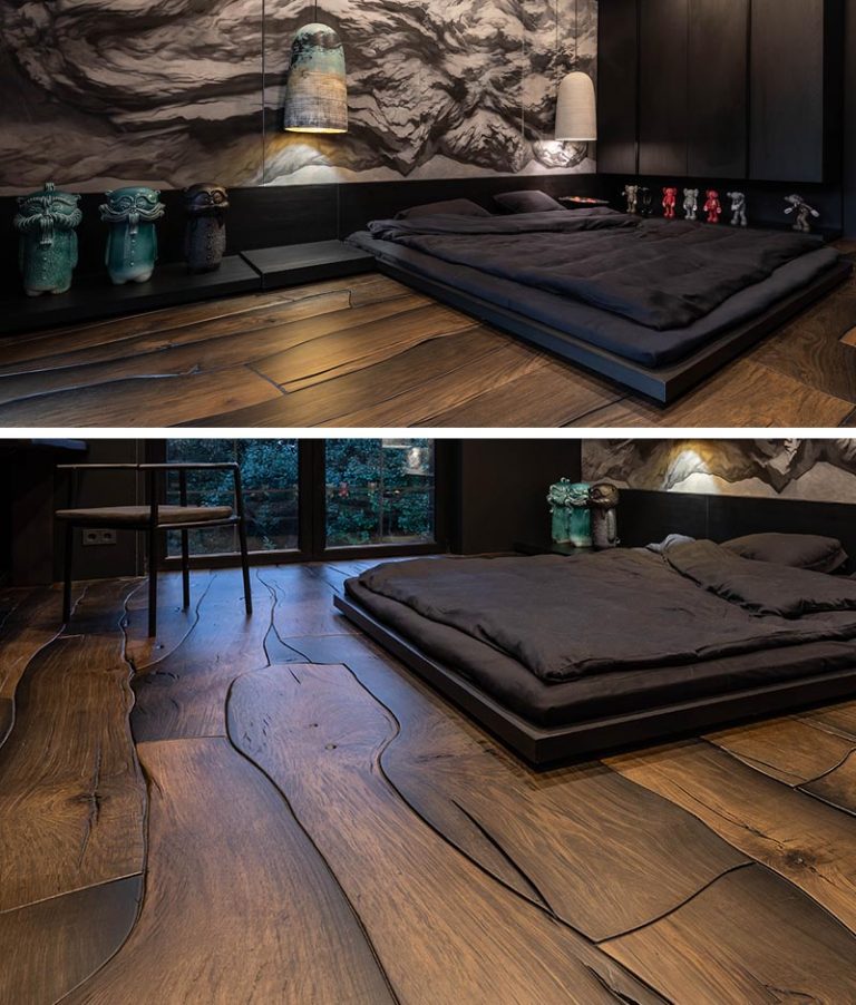 This Masculine Bedroom Has A Dramatic Wall Mural And Unique Wood Floors