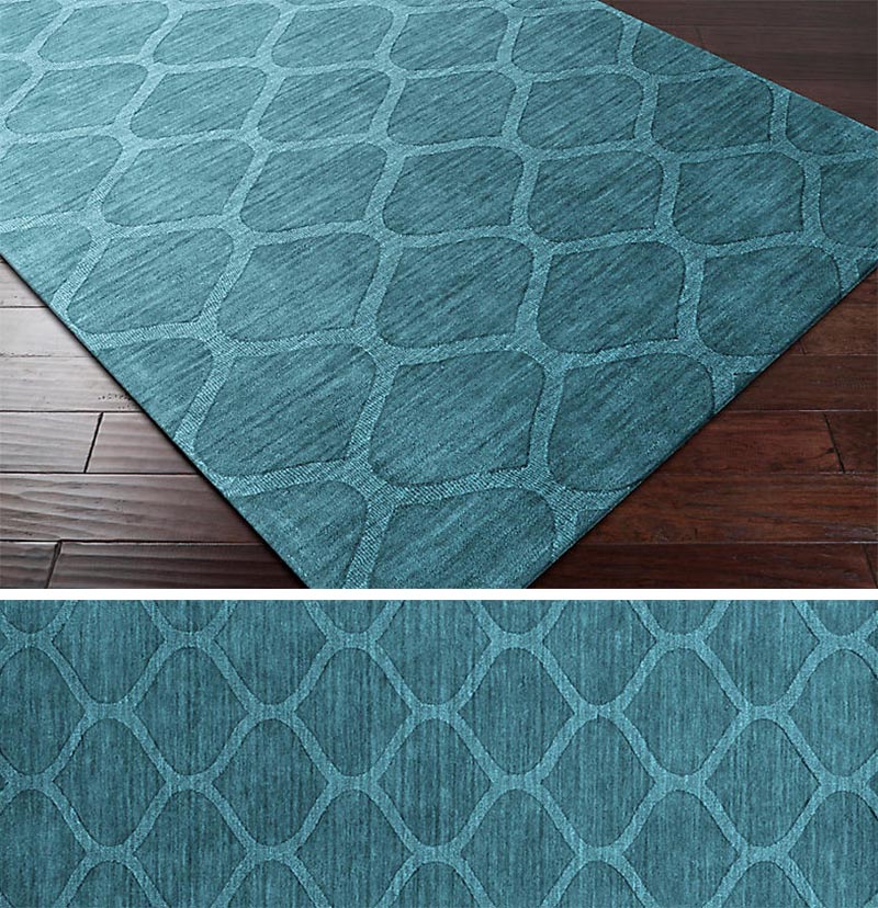 A rug is a way of introducing a pattern to any modern interior. By keeping the color and pattern simple, it allows the rug to add a subtle design element that doesn't distract from the overall look of the room. #ModernRug #PatternedRug #BlueRug #HomeDecor