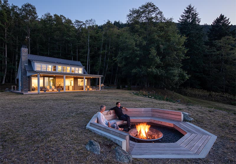 An octagonal outdoor fire pit with seating.