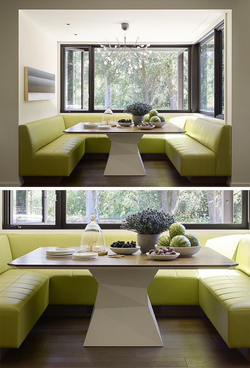 A built-in dining nook with wrap-around banquette seating in a lime green.