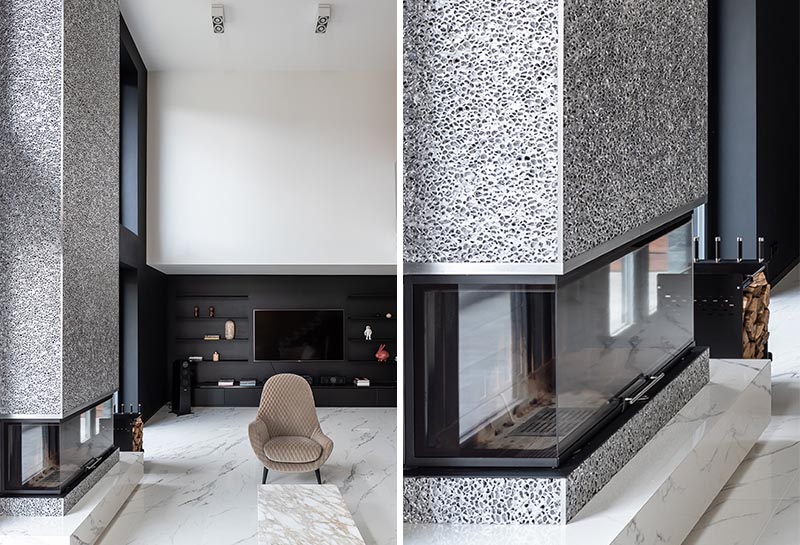 Sergey Makhno Architects recently completed a new house, and as part of the living room, they created a modern fireplace surround made from metal lace. #ModernFireplace #MetalFireplace #LivingRoom #MetalFireplaceSurround #Interiors #FireplaceDesign