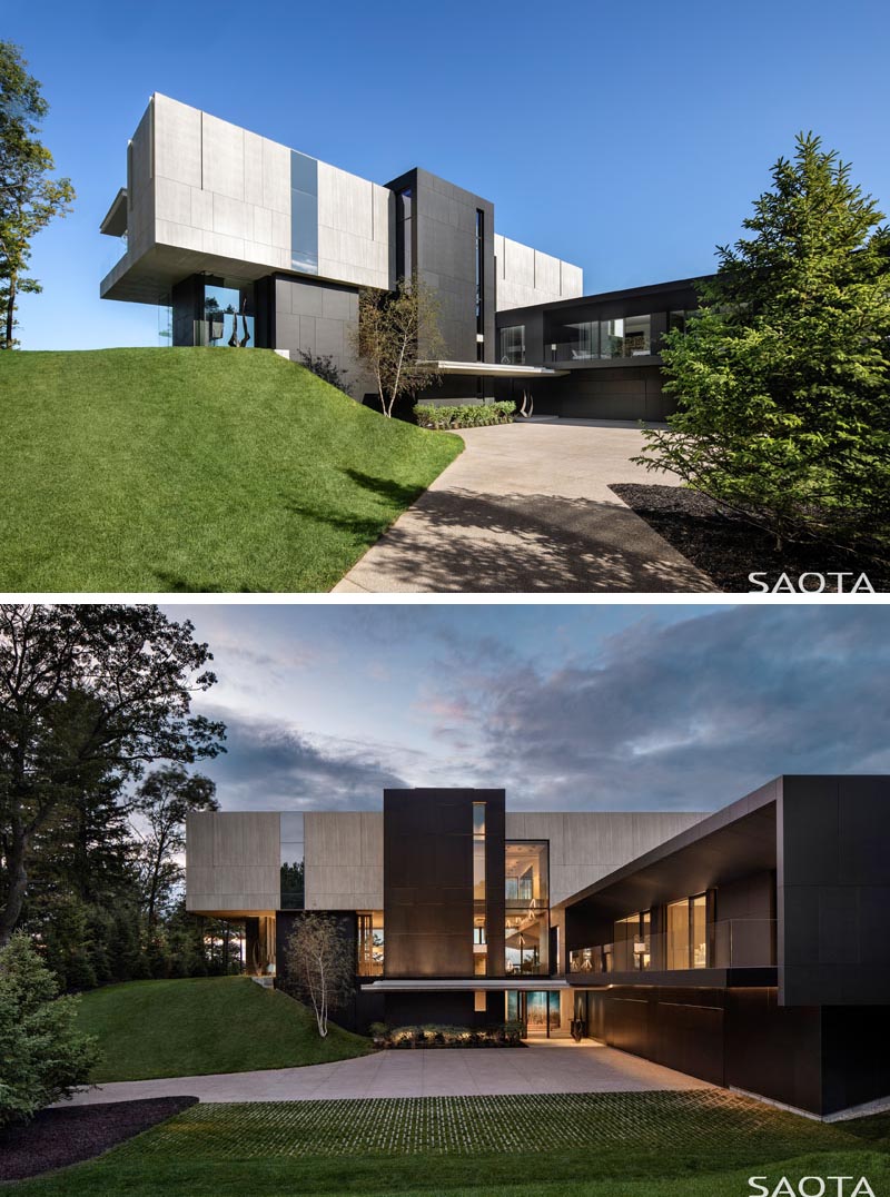 A driveway positioned between mature fir trees leads you to the parking area, which is the ideal position to take in the stacked box design of the home, as well as the ceramic paneled system that covers the exterior. #ModernArchitecture #ModernHouse #HouseDesign