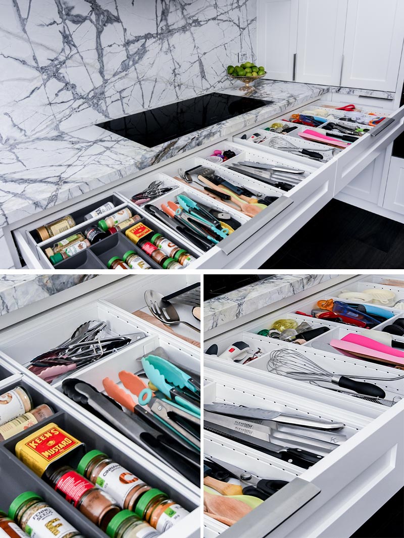 Underneath the induction cooktop in this modern kitchen, is a pair of neatly organized drawers with everything you need when cooking, like spices, tongs, spatulas, and other little cooking gadgets. #KitchenDesign #KitchenIdeas #KitchenStorage #KitchenOrganization