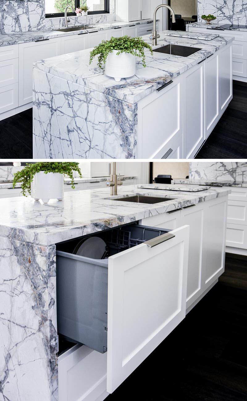 This modern kitchen island has a hidden dishwasher disguised as a drawer. #HiddenDishwasher #IntegratedDishwasher #KitchenDesign #KitchenIdeas