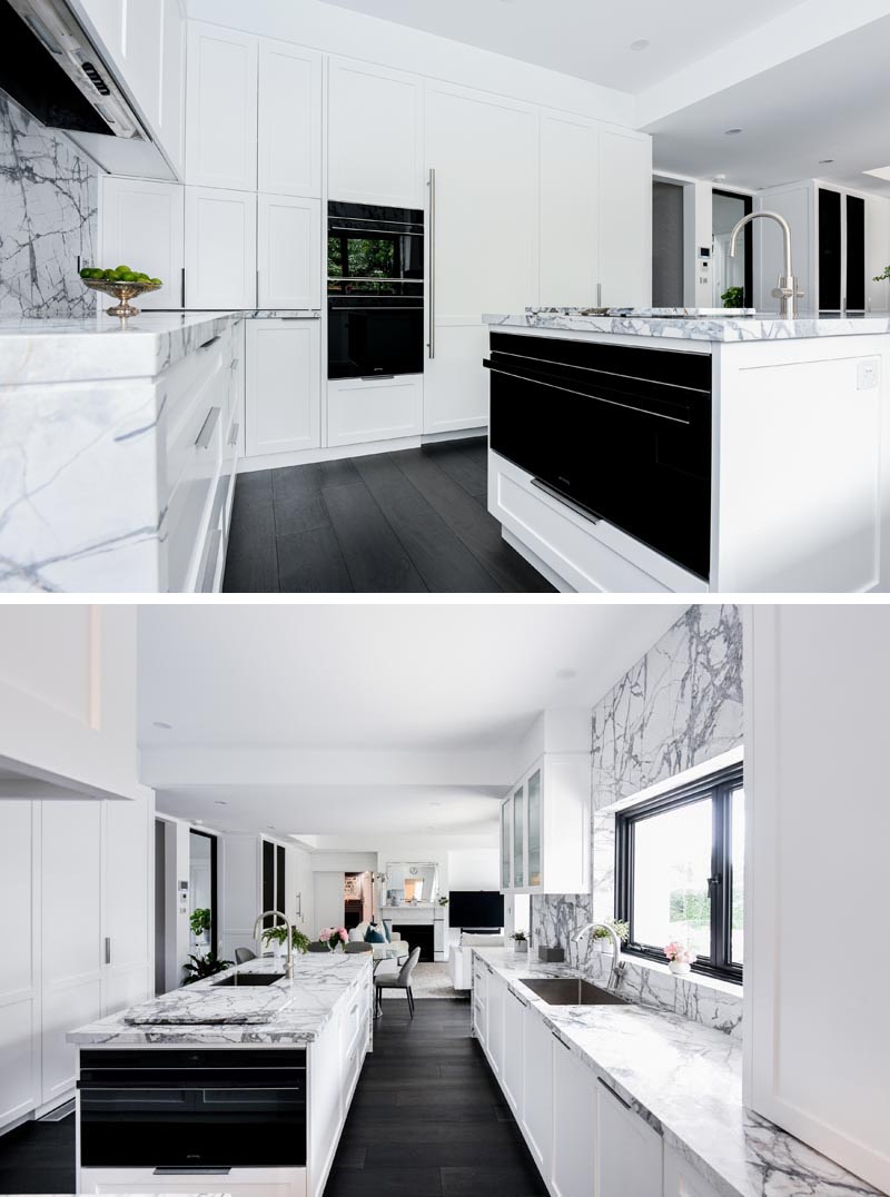 At the end of this modern kitchen island, there's a built-in oven that complements the others built into the cabinetry nearby. #KitchenDesign #KitchenIsland #KitchenIdeas