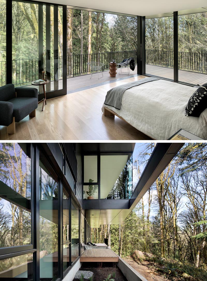 This modern master bedroom has sliding glass doors that open directly to the balcony, creating an indoor / outdoor space that overlooks the trees. #GlassWalls #MasterBedroom #ModernBedroom #Windows