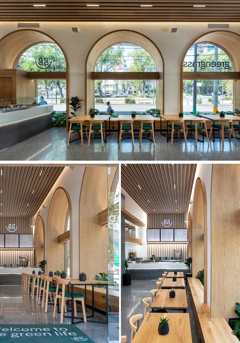 Wood-lined arches with matching windows create alcoves that are deep enough to include plants and a bench seat. #RestaurantSeating #RestaurantWindows #InteriorDesign #WoodArches #ArchedWindows 