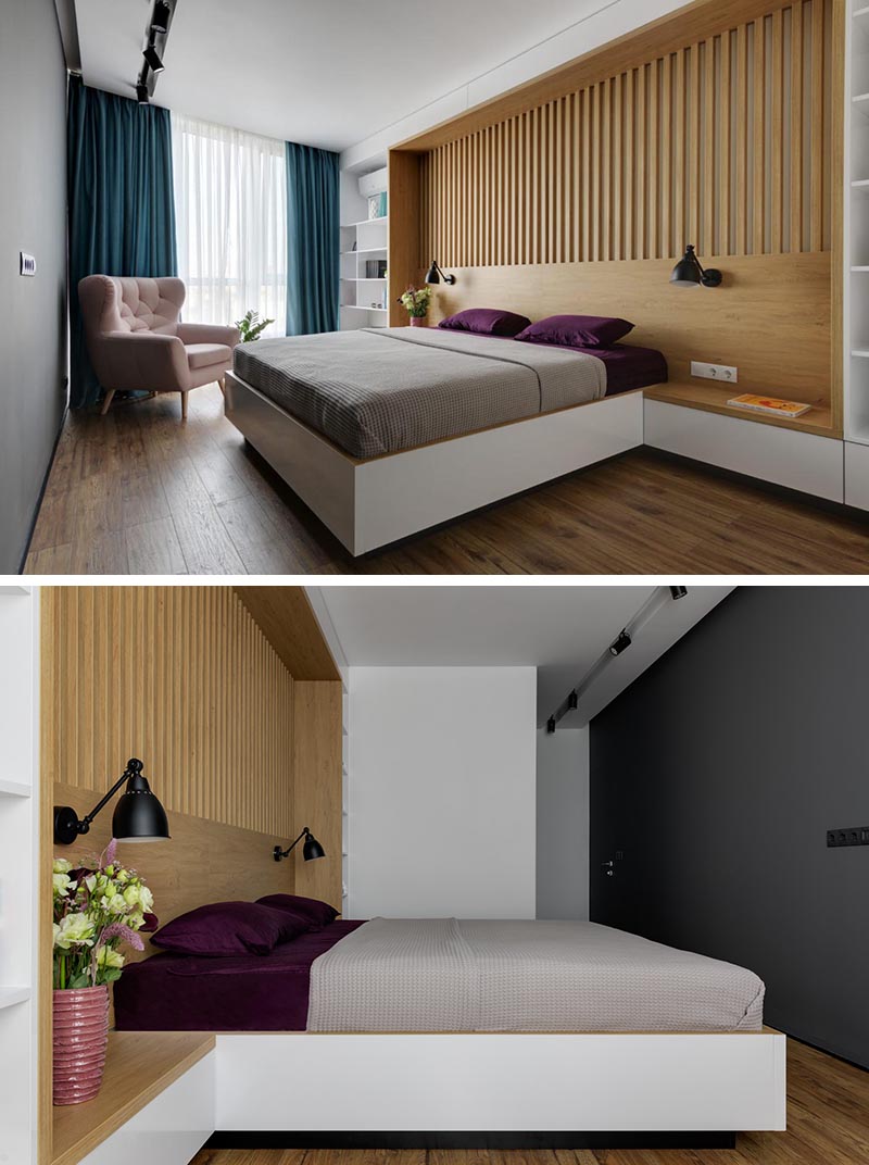 Ukrainian interior design firm K-BAND has designed a modern bedroom for an apartment in Kyiv, and in one of the bedrooms, they created an entire custom wall that includes a headboard, side tables, and bookshelves. #BedroomDesign #ModernBedroom