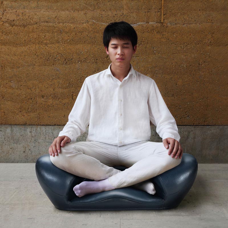 A meditation seat that allows the user to sit cross-legged comfortably.