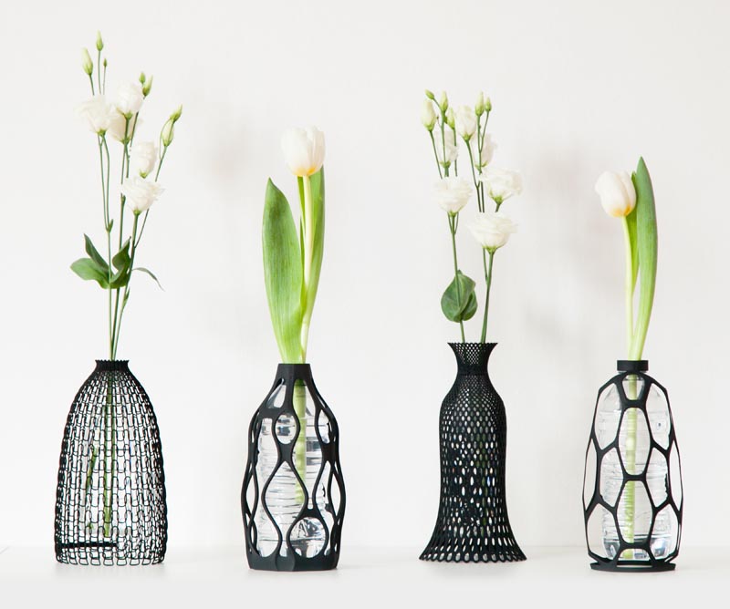 3D printed vases with a black silhouette.