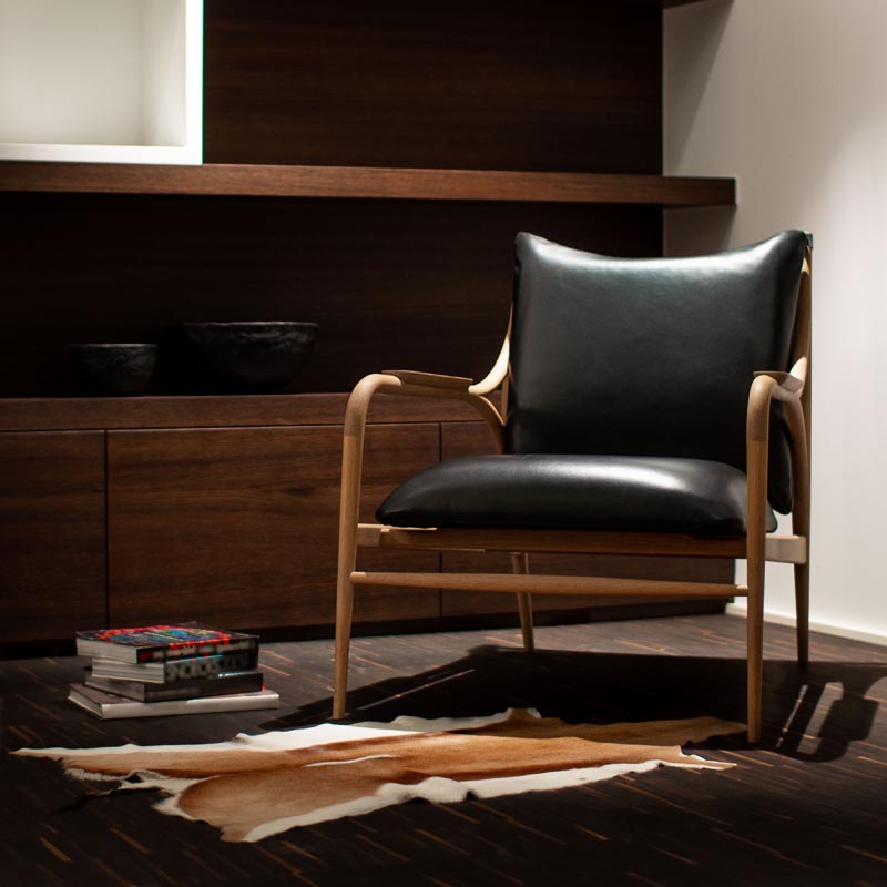 A leather and wood armchair.