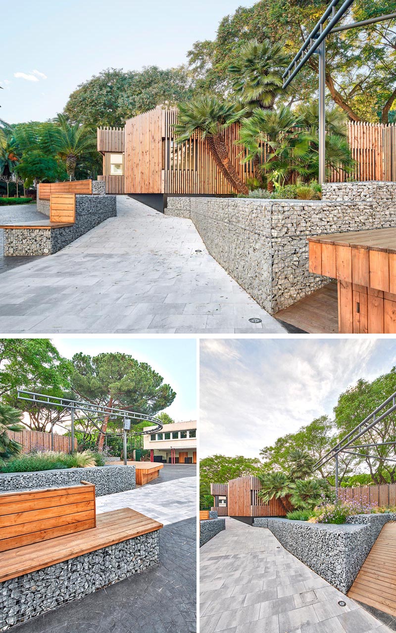 The zig-zag gabion walls form the basis of the bench seating and provide retaining walls for the surrounding gardens and the stage. #Gabions #GabionBench #GabionRetainingWall #Landscaping #LandscapeDesign