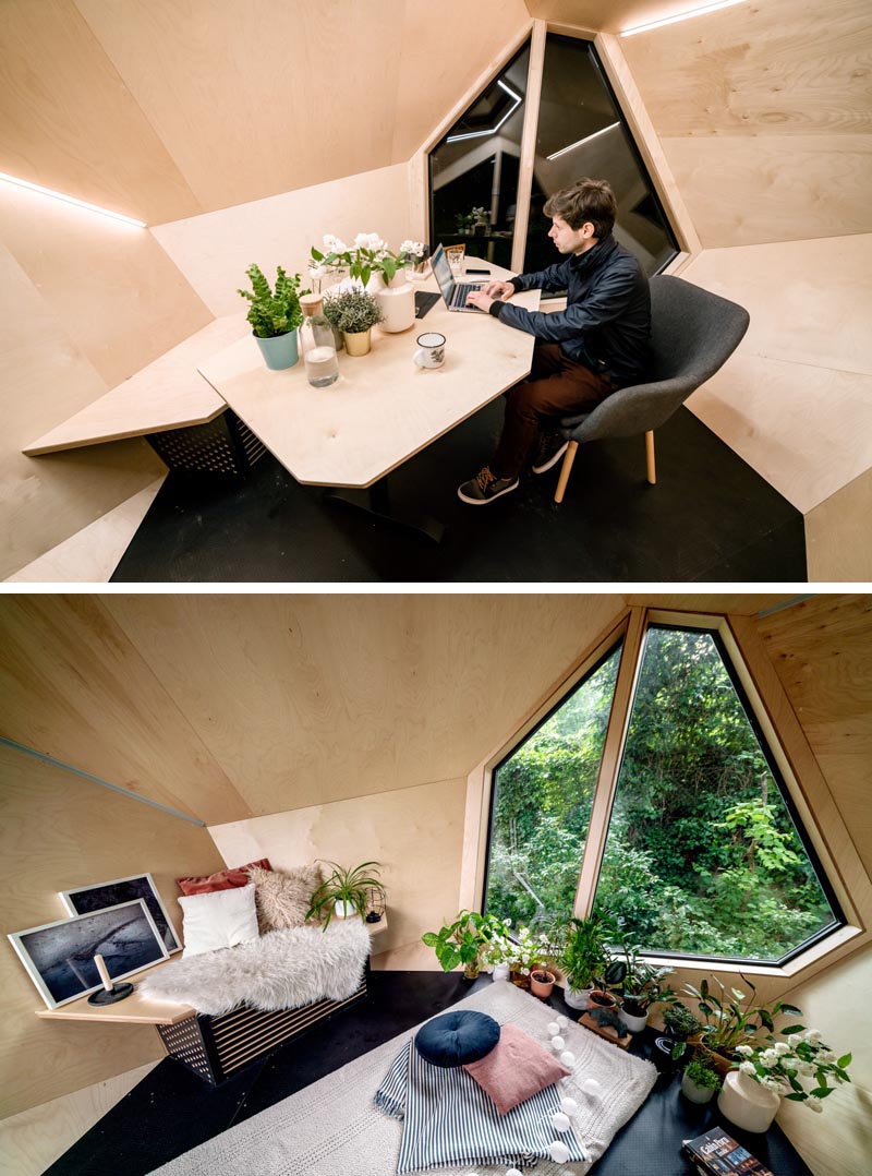 The inside this backyard home office, which can also function as a guest room or a playroom for kids, is lined with natural Scots pine wood, is insulated, has built-in A/C, and strips of lighting on the angular walls, as well as a built-in desk with electrical outlets. #BackyardHomeOffice #BackyardStudio #BackyardGuestSuite #HomeOffice