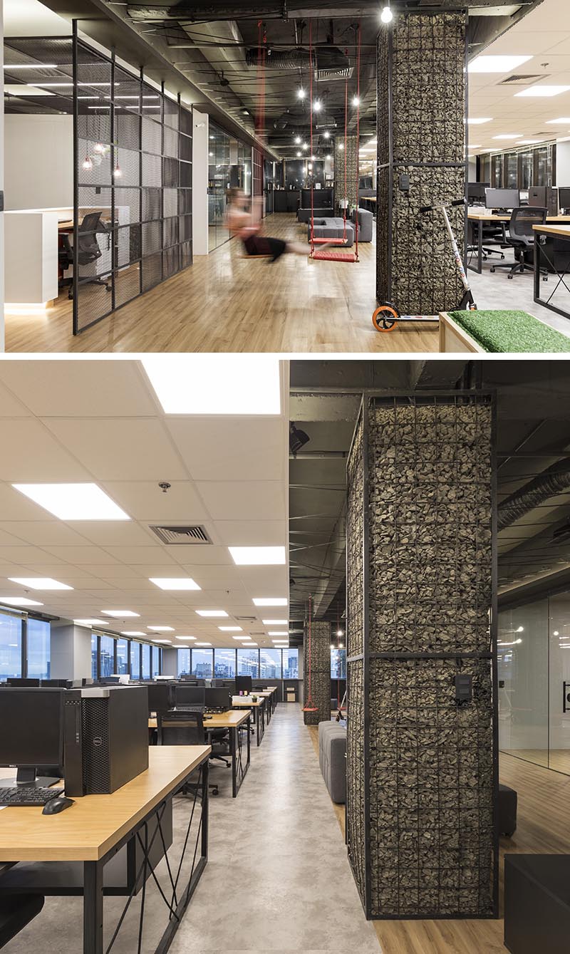 Columns, whether they're in the workplace or at home, are often left as raw concrete or simply painted, however in this office the columns have been turned into feature accents named gabions. #Gabion #WorkplaceDesign #Columns