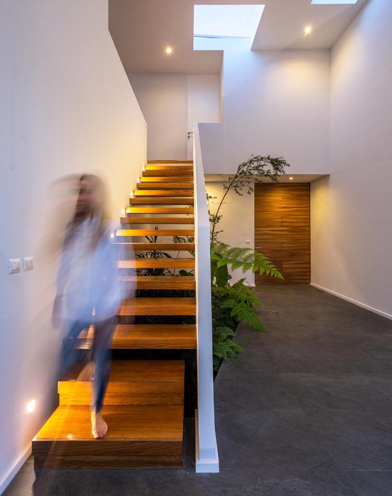 Jaime Juarez Arquitecto has designed a house in Morelia city, Mexico, that features a small indoor garden underneath the stairs. #IndoorGarden #StairDesign #Plants #InteriorDesign