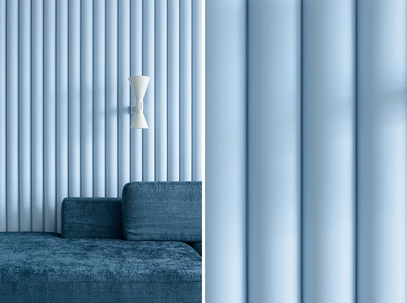 Designed as a way of adding texture to the room, this soft blue accent wall is made from panels that have ribbed finish, allowing the natural light to create ever-changing shadows on the wall. #SoftBlueInterior #BlueAccentWall #TexturedAccentWall #InteriorDesign #Blue #LivingRoom