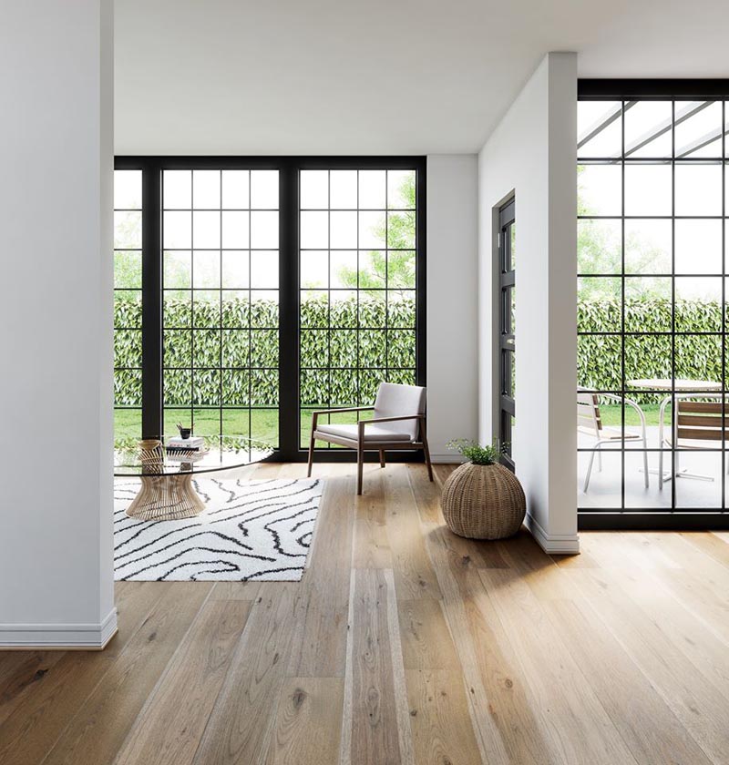 Light-toned wide plank wood flooring is often chosen for contemporary homes, as it adds visual interest to an interior without drawing attention away from other design elements. #WidePlankFlooring #LightWoodFlooring #FlooringIdeas
