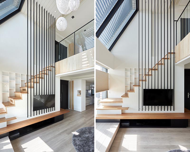 This modern apartment uses black poles to provide a safety element for the stairs, replacing the need for a handrail on the higher section. #Stairs #StairDesign #TVMount