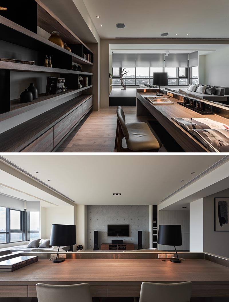 The concrete surround of this large desk, houses a wood work surface with drawers, and is long enough for two people to work side-by-side. There's also a small interior metallic border that provides a place for electrical outlets. #HomeOffice #Desk #InteriorDesign