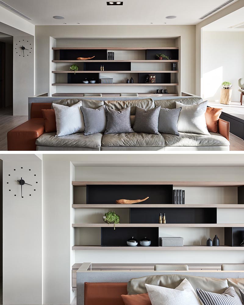 Wood and metal shelving and cabinetry has been added into an alcove behind a desk, creating a place for displaying decorative objects or storing work related items. #Shelving #HomeOffice