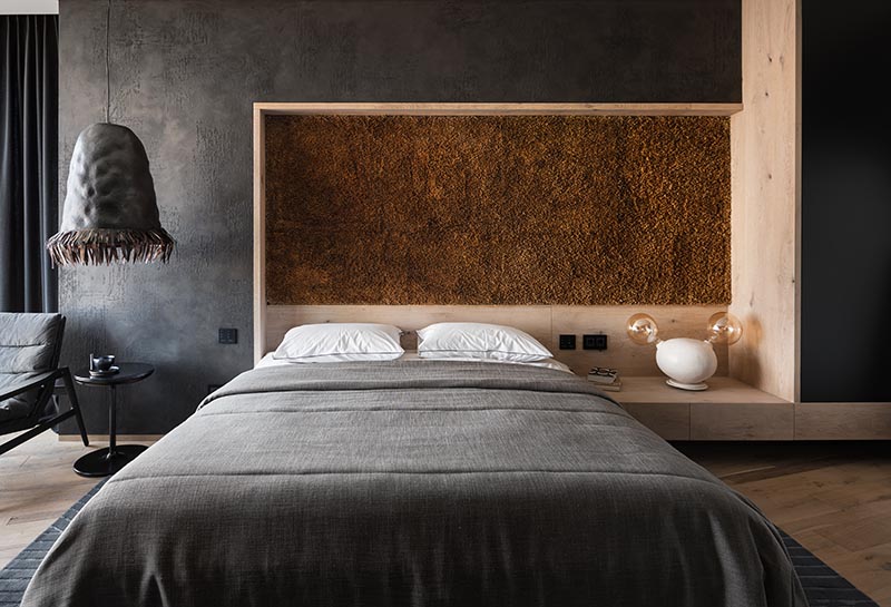 This modern bedroom accent wall adds a textural element and is made from hundreds of bulrush reed stems that were collected and assembled by hand. #AccentPanel #AccentWall #BulrushStems #TexturedPanel #InteriorDesign #BedroomDesign