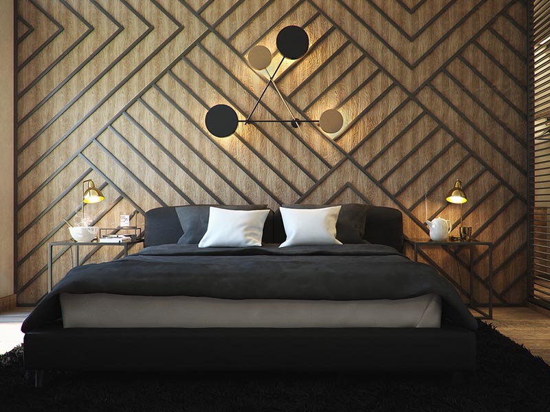 The warm wood accent wall in this modern has been adorned with black stripes, arranged to create a geometric pattern, and complement the square bedside tables and the furnishing choices. #BedroomAccentWall #AccentWall #FeatureWall #BedroomDesign #BlackDecor