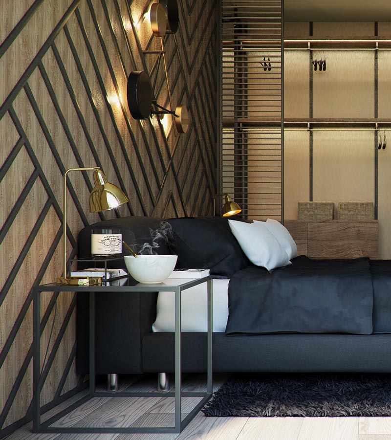 The warm wood accent wall in this modern has been adorned with black stripes, arranged to create a geometric pattern, and complement the square bedside tables and the furnishing choices. #BedroomAccentWall #AccentWall #FeatureWall #BedroomDesign #BlackDecor