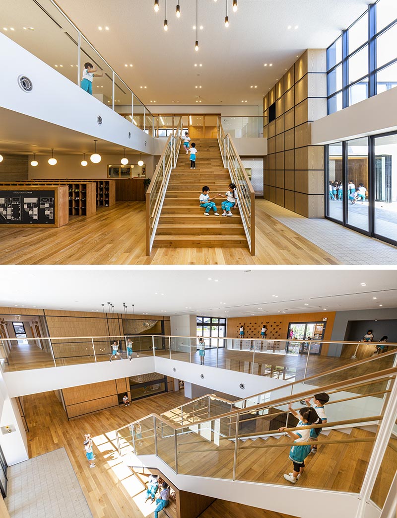 Located underneath the lower half of these kindergarten stairs is a wood framed area that's home to kids play area with a small ball pit. #KidsPlayArea #UnderStairDesign #KidsBallPit #InteriorDesign