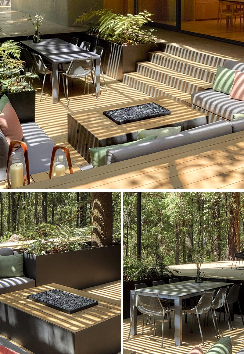 An outdoor conversation pit with fire table, dining area, lounge, and planters.