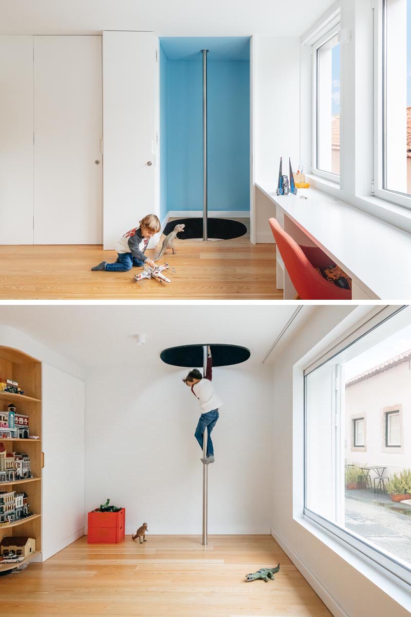 This modern kids room features a fire pole, which connects the bedroom with a lower floor play room, allowing the children (and adults), to have fun by sliding down the pole instead of using the stairs. #FirePole #FiremansPole #InteriorDesign #KidsBedroom