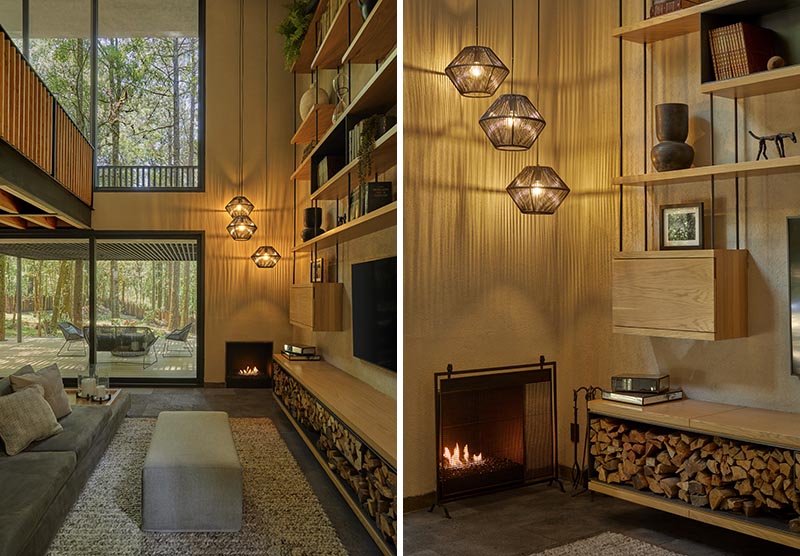 An open low cabinet lined with steel creates a place for firewood storage.