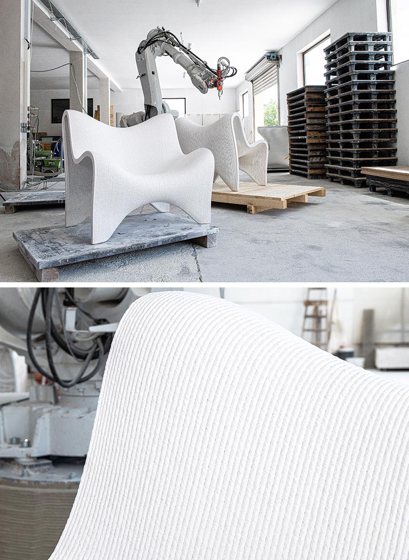 A pair of 3D printed outdoor chairs made from concrete.