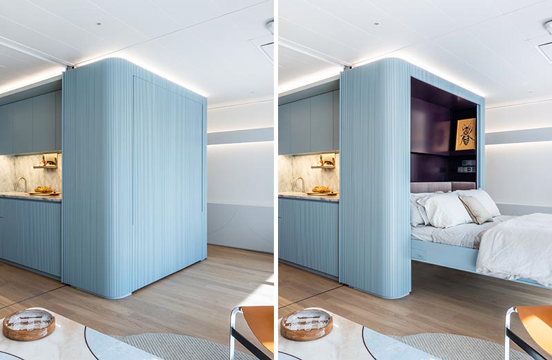 A blue wall with a hidden fold-down murphy bed.