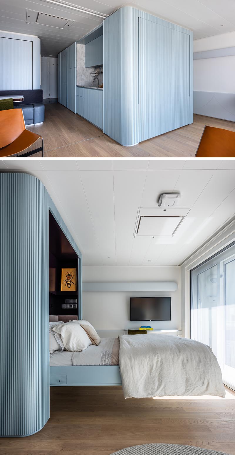 A murphy bed is hidden within a blue textured wall.