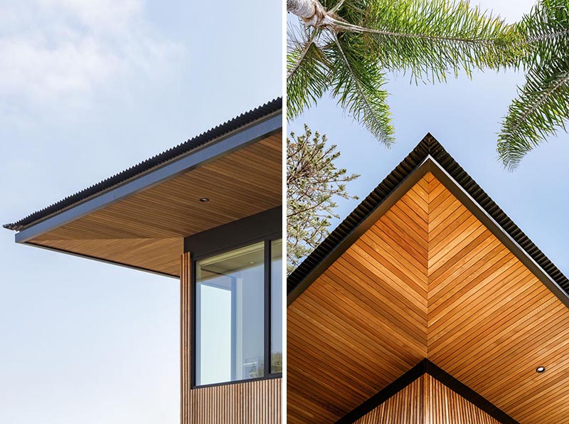 Deep roof eaves meet the wood siding that's made from cedar.