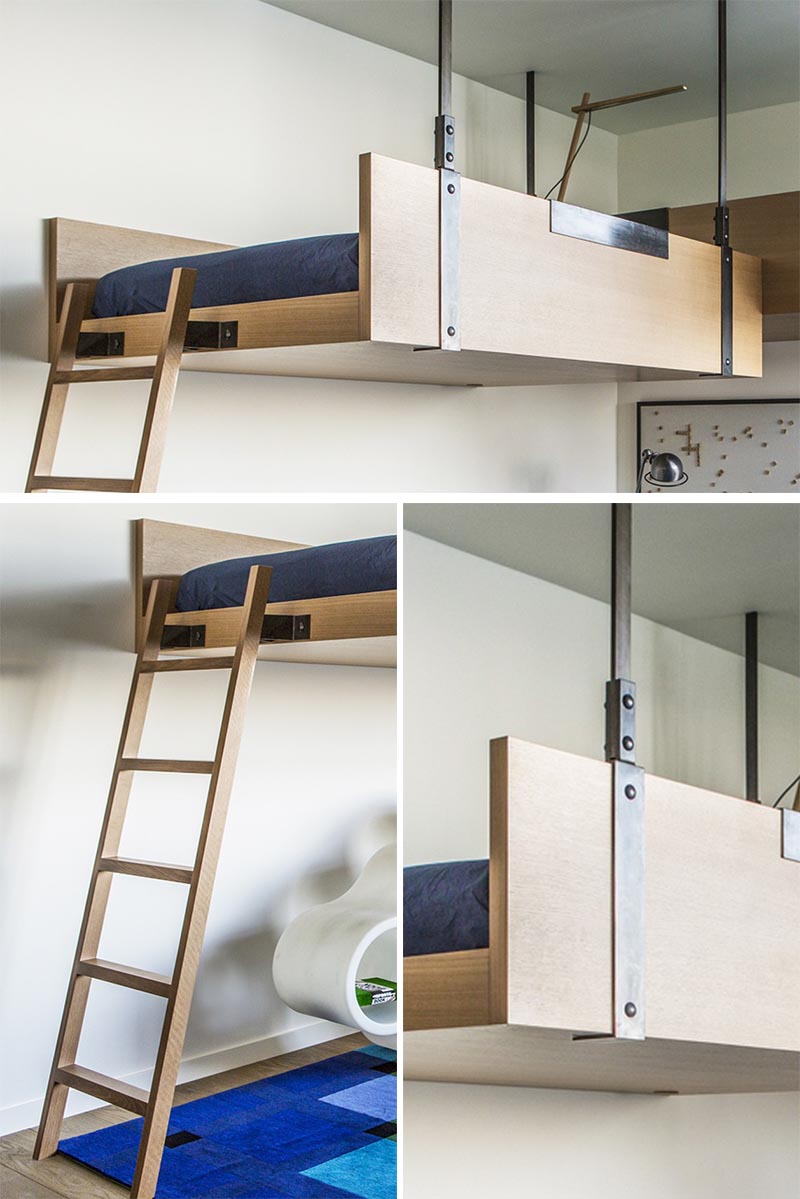 A fun kids bedroom with a bed hanging from the ceiling.