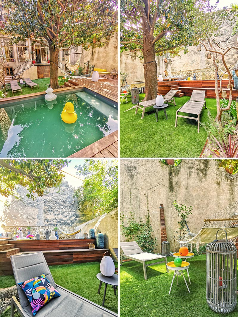 A landscaped backyard with a grassy area, raised deck, and a small swimming pool.