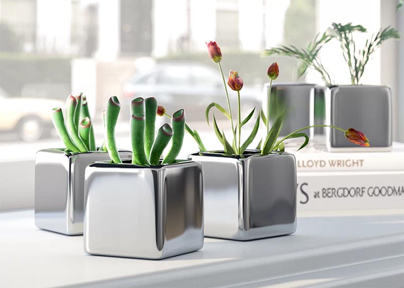 A set of mini cube succulent pots with a sleek metallic finish.