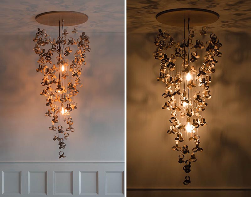 A modern chandelier made from wood curls that appear to float in space.