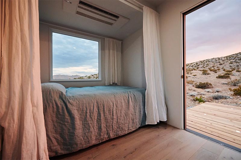 A small bedroom with a picture window.