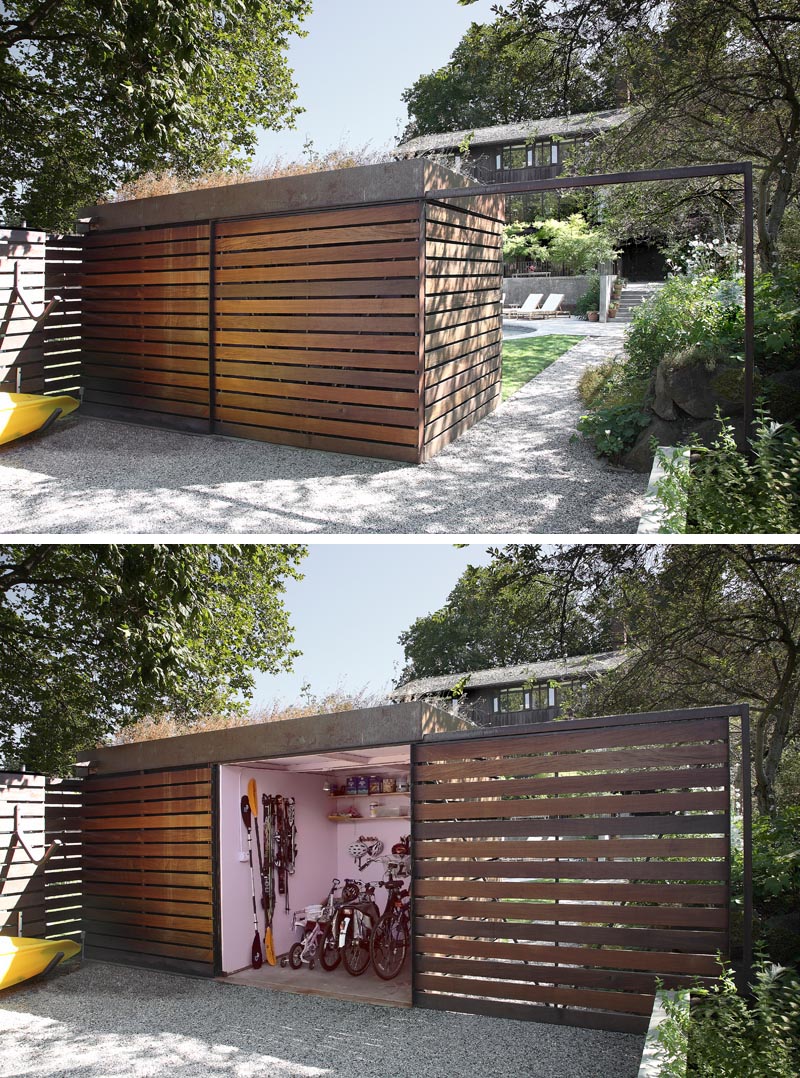 A modern backyard shed that hides a bike storage room behind a sliding door.