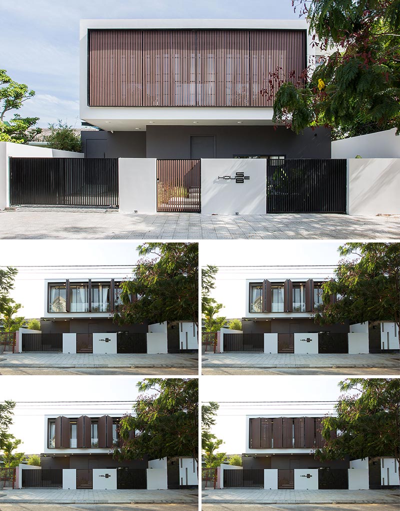 Wood shutters on the second floor of this house provide protection from the elements.