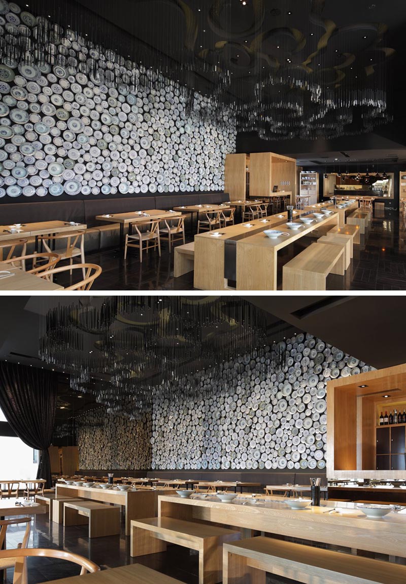 An entire wall within this modern restaurant has been covered in traditional noodle bowls to create an eye-catching accent wall.