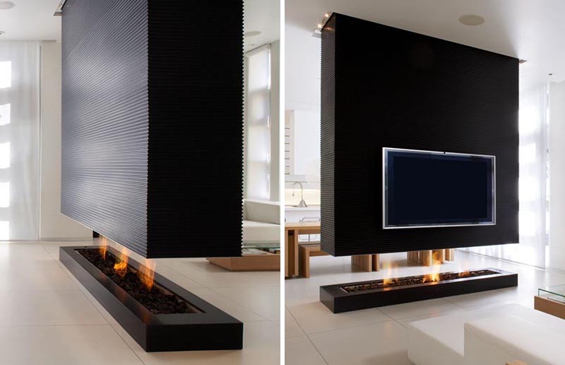 This Room Divider Is A Suspended Wall That Also Includes A Fireplace And TV