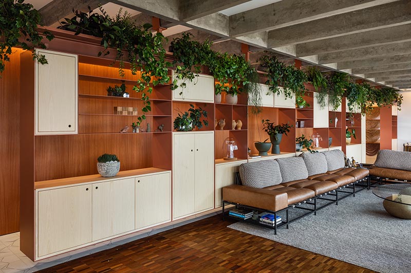 Movable shelving is a key design element in this Brazilian apartment.