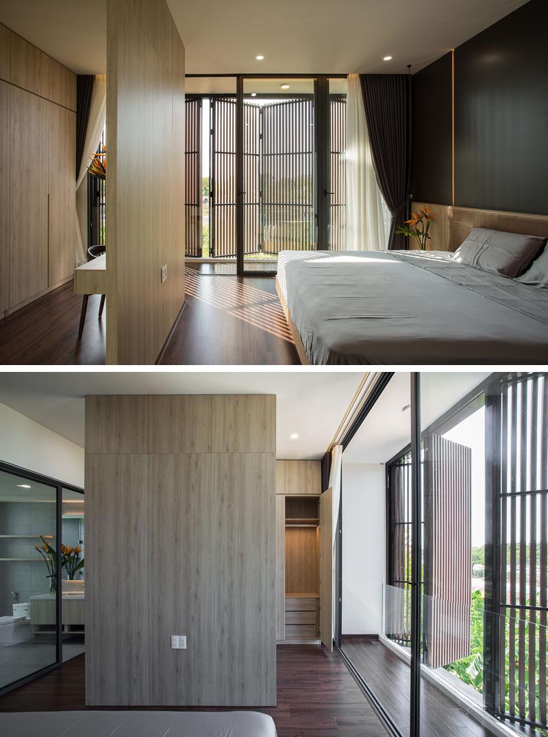 A wood room divider separates the sleeping area in the bedroom from the closet.