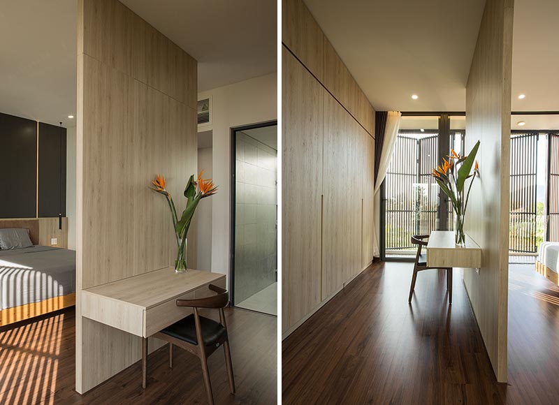 A bedroom room divider creates a space for a floating desk.