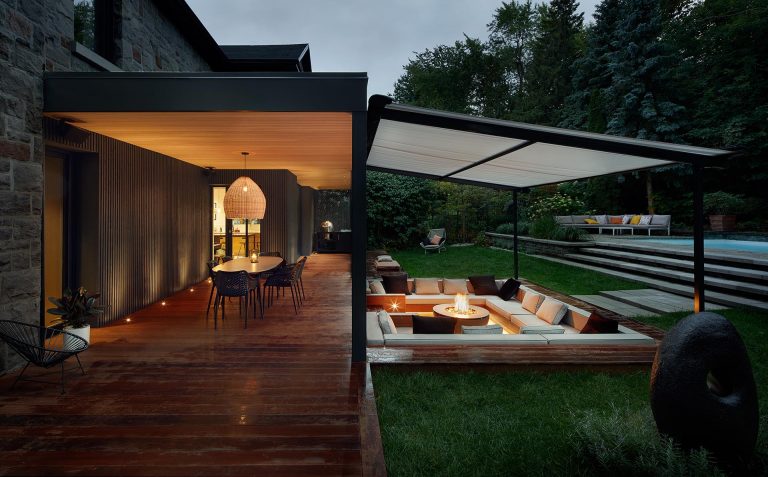 A Covered Outdoor Conversation Pit With A Fire Bowl Creates A Cozy Place To Relax At Night